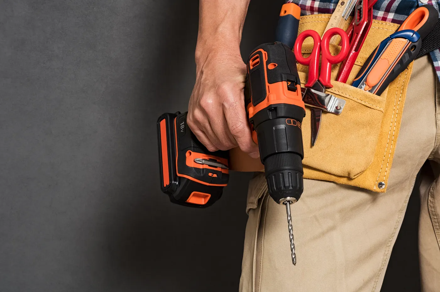 A contractor's tool belt and drill, ready for a remodeling job